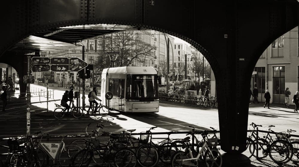 A flat-bar hybrid commuter bicycle parked in a city street