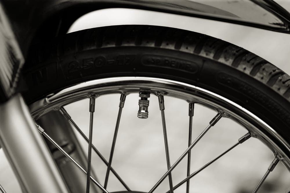 Close detail of a bicycle tire tread and spokes