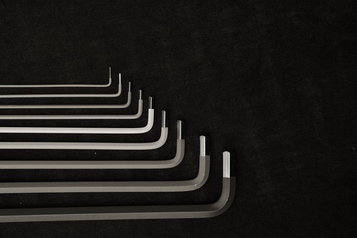 Hex keys and bicycle tools laid out on a workbench